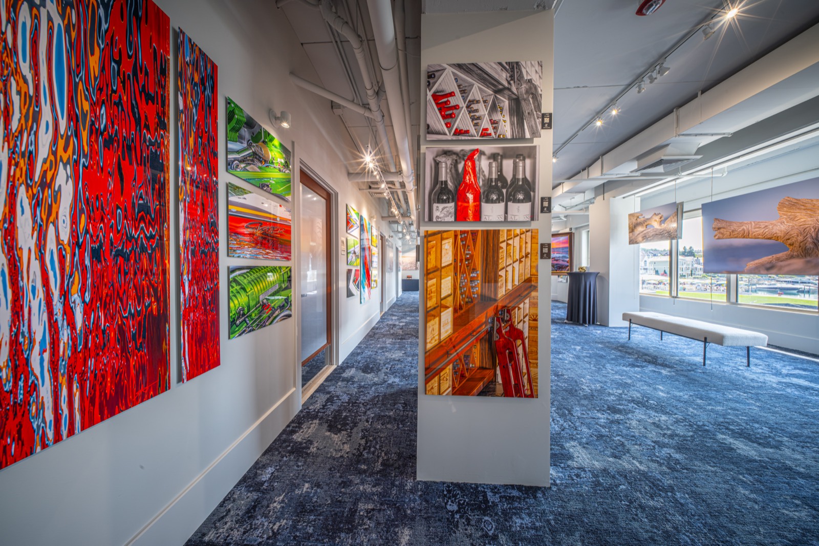 Aluminum sublimation works lining the gallery corridor at Alexander Kippe Fine Art, Bay Harbor, Michigan